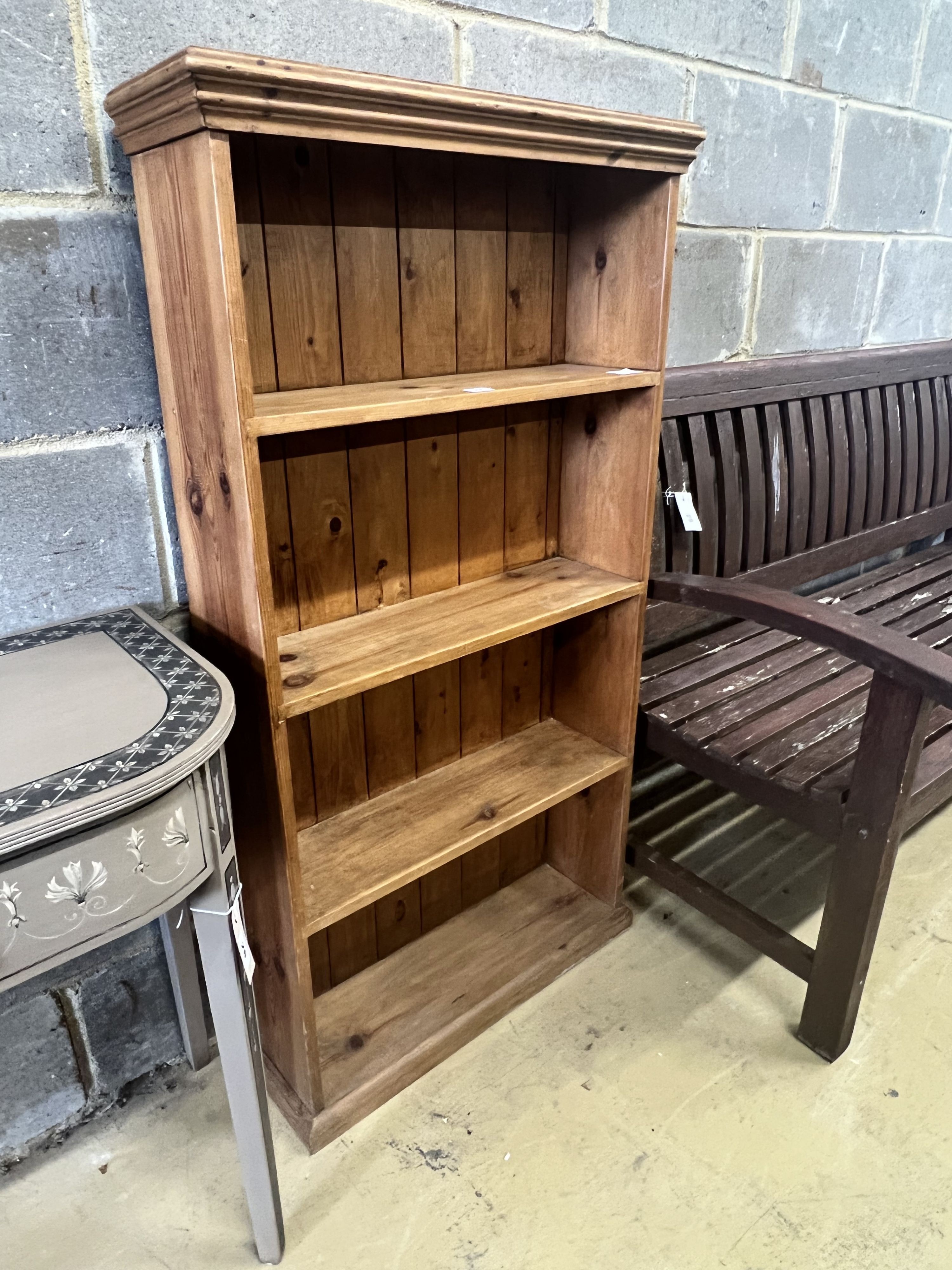 A pine open bookcase, width 66cm depth 21cm height 125cm